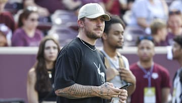 Sep 16, 2023; College Station, Texas, USA; Former Texas A&M Aggies player Johnny Manziel watches from the sideline during the first half of the game between the Aggies and the Louisiana Monroe Warhawks at Kyle Field. Mandatory Credit: Troy Taormina-Imagn Images