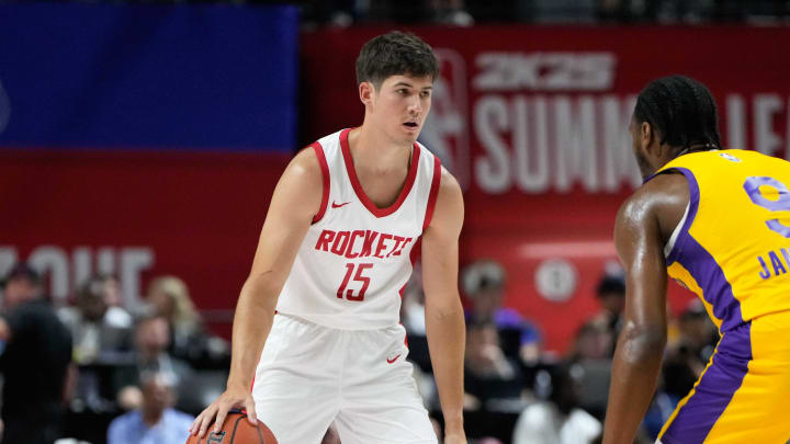 Jul 12, 2024; Las Vegas, NV, USA; Houston Rockets guard Reed Sheppard (15) dribbles the ball against Los Angeles Lakers guard Bronny James (9) during the first half at Thomas & Mack Center. Mandatory Credit: Lucas Peltier-USA TODAY Sports