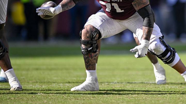 Dec 20, 2025; College Station, TX, USA; Texas A&M Aggies offensive lineman Chase Bisontis (71) blocks the rush during the game between the Aggies and the Hurricanes at Kyle Field. 