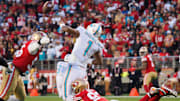 Dec 4, 2022; Santa Clara, California, USA; San Francisco 49ers defensive end Nick Bosa (97) forces a fumble against Miami Dolphins quarterback Tua Tagovailoa (1) during the fourth quarter at Levi's Stadium. Mandatory Credit: Kelley L Cox-Imagn Images