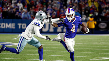 Buffalo Bills running back James Cook (4) tries to get around Dallas Cowboys cornerback Jourdan Lewis (2). Cook rushed for 179 yards.