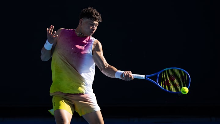 Jan 14, 2025; Melbourne, Victoria, Australia; Ben Shelton of United States of America hits a forehand during his match against Brandon Nakashima of United States of America in the first round of the men's singles at the 2025 Australian Open at Melbourne Park. Mandatory Credit: Mike Frey-Imagn Images
