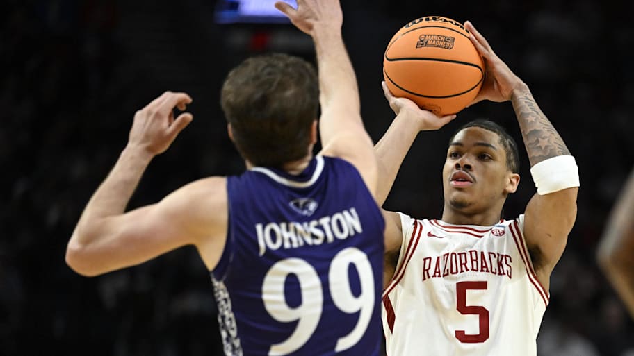 Arkansas Razorbacks guard Darius Acuff Jr. shoots over High Point Panthers guard Chase Johnston.