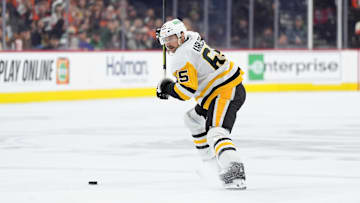 Feb 8, 2025; Philadelphia, Pennsylvania, USA; Pittsburgh Penguins defenseman Erik Karlsson (65) winds up against the Philadelphia Flyers in the third period at Wells Fargo Center. Mandatory Credit: Kyle Ross-Imagn Images