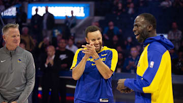 Oct 11, 2024; San Francisco, California, USA; Golden State Warriors head coach Steve Kerr, from left, guard Stephen Curry and forward Draymond Green share a laugh before taking on the Sacramento Kings at Chase Center. Mandatory Credit: D. Ross Cameron-Imagn Images
