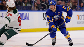 Nov 27, 2024; Buffalo, New York, USA;  Buffalo Sabres center Dylan Cozens (24) skates up ice with the puck during the second period against the Minnesota Wild at KeyBank Center. Mandatory Credit: Timothy T. Ludwig-Imagn Images