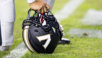 Nov 23, 2024; Baton Rouge, Louisiana, USA;  Detailed view of the Vanderbilt Commodores helmet on the turf against the LSU Tigers during the first half at Tiger Stadium. Mandatory Credit: Stephen Lew-Imagn Images