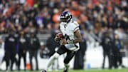 Nov 16, 2025; Cleveland, Ohio, USA; Baltimore Ravens quarterback Lamar Jackson (8) runs for a gain during the first quarter against the Cleveland Browns at Huntington Bank Field. Mandatory Credit: Scott Galvin-Imagn Images