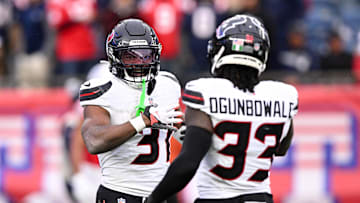 Oct 13, 2024; Foxborough, Massachusetts, USA; Houston Texans running back Dameon Pierce (31) celebrates with running back Dare Ogunbowale (33) after scoring a touchdown against the New England Patriots during the first half at Gillette Stadium. Mandatory Credit: Brian Fluharty-Imagn Images