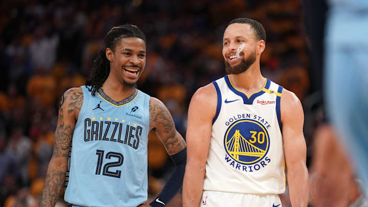Apr 15, 2025; San Francisco, California, USA; Memphis Grizzlies guard Ja Morant (12) talks with Golden State Warriors guard Stephen Curry (30) in between free throw by Curry in the fourth quarter at the Chase Center. Mandatory Credit: Cary Edmondson-Imagn Images