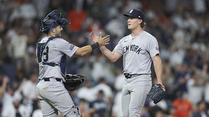 Mar 29, 2024; Houston, Texas, USA; New York Yankees relief pitcher Clayton Beeter (29) celebrates with catcher Austin Wells (28) after the game against the Houston Astros at Minute Maid Park. Mar 29, 2024; Houston, Texas, USA; New York Yankees relief pitcher Clayton Beeter (29) celebrates with catcher Austin Wells (28) after the game against the Houston Astros at Minute Maid Park.