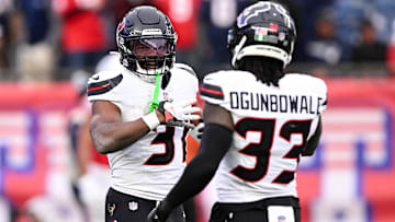 Houston Texans running back Dameon Pierce (31) celebrates with running back Dare Ogunbowale (33) after scoring a touchdown against the New England Patriots during the first half at Gillette Stadium. Mand