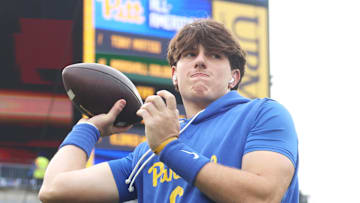 Nov 15, 2025; Pittsburgh, Pennsylvania, USA;  Pittsburgh Panthers quarterback Mason Heintschel (6) warms up before the game against the Notre Dame Fighting Irish at Acrisure Stadium. Mandatory Credit: Charles LeClaire-Imagn Images