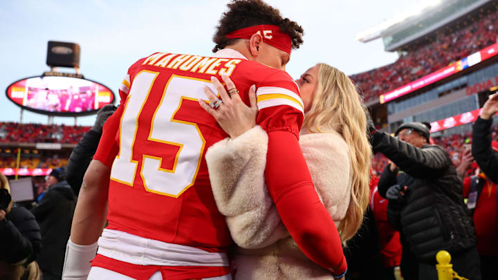 Kansas City Chiefs quarterback Patrick Mahomes (15) and Brittany Mahomes react before the AFC Championship game against the Buffalo Bills at GEHA Field at Arrowhead Stadium.