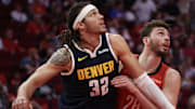 Apr 13, 2025; Houston, Texas, USA; Denver Nuggets forward Aaron Gordon (32) boxes out Houston Rockets center Alperen Sengun (28) in the second quarter at Toyota Center.
