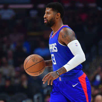 Los Angeles Clippers forward Paul George (13) moves the ball up the court against the Orlando Magic during the first half at Crypto.com Arena. 
