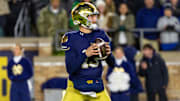 Nov 8, 2025; South Bend, Indiana, USA; Notre Dame Fighting Irish quarterback CJ Carr (13) looks to pass against the Navy Midshipmen during the first half at Notre Dame Stadium. Mandatory Credit: Michael Caterina-Imagn Images