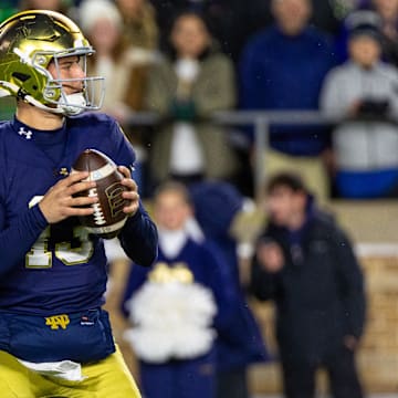Nov 8, 2025; South Bend, Indiana, USA; Notre Dame Fighting Irish quarterback CJ Carr (13) looks to pass against the Navy Midshipmen during the first half at Notre Dame Stadium. Mandatory Credit: Michael Caterina-Imagn Images