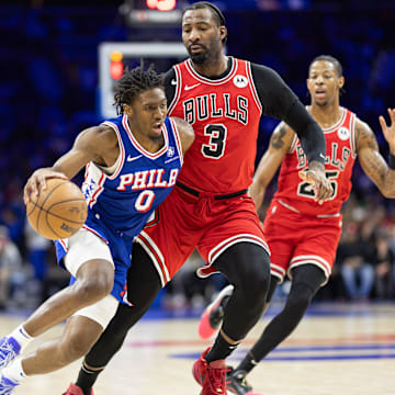 Dec 18, 2023; Philadelphia, Pennsylvania, USA; Philadelphia 76ers guard Tyrese Maxey (0) and Chicago Bulls center Andre Drummond (3) in action during the second quarter at Wells Fargo Center. Mandatory Credit: Bill Streicher-Imagn Images