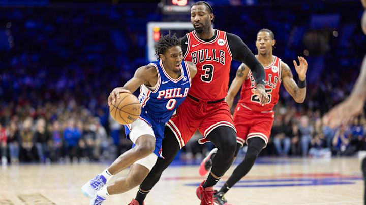 Dec 18, 2023; Philadelphia, Pennsylvania, USA; Philadelphia 76ers guard Tyrese Maxey (0) and Chicago Bulls center Andre Drummond (3) in action during the second quarter at Wells Fargo Center. Mandatory Credit: Bill Streicher-Imagn Images