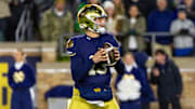 Nov 8, 2025; South Bend, Indiana, USA; Notre Dame Fighting Irish quarterback CJ Carr (13) looks to pass against the Navy Midshipmen during the first half at Notre Dame Stadium. 