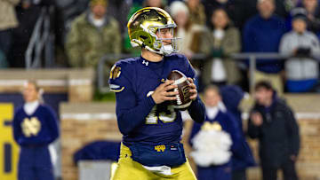 Nov 8, 2025; South Bend, Indiana, USA; Notre Dame Fighting Irish quarterback CJ Carr (13) looks to pass against the Navy Midshipmen during the first half at Notre Dame Stadium. 
