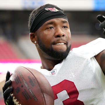 Arizona Cardinals safety Budda Baker (3) plays catch with fans during training camp at State Farm Stadium in Glendale on July 28, 2024.