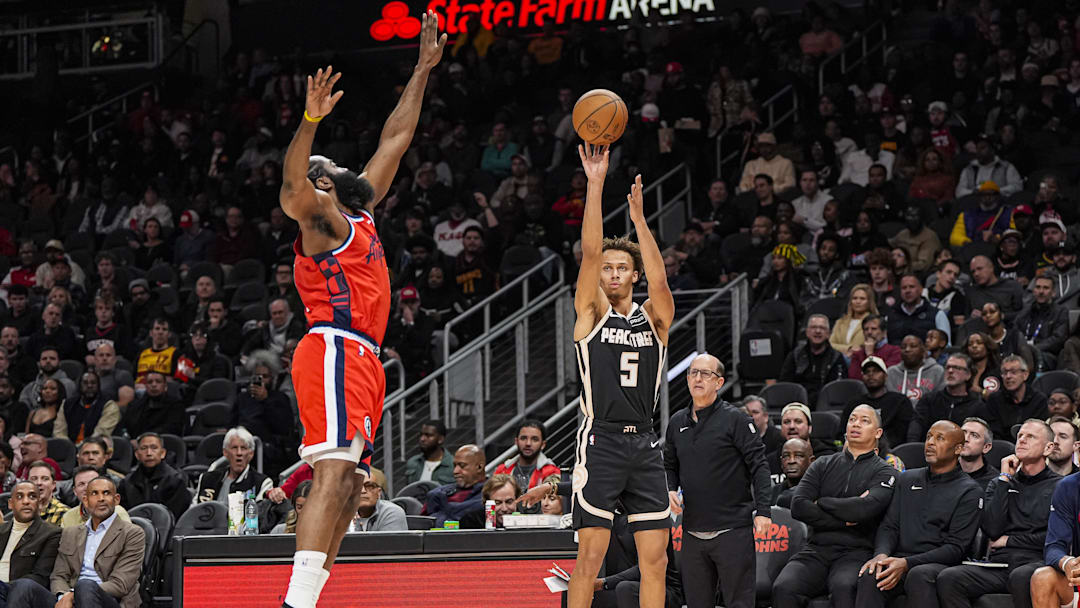 Dec 3, 2025; Atlanta, Georgia, USA; Atlanta Hawks guard Dyson Daniels (5) shoots over LA Clippers guard James Harden (1) during the first half at State Farm Arena. Mandatory Credit: Dale Zanine-Imagn Images