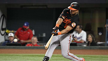 Oct 10, 2023; Arlington, Texas, USA; Baltimore Orioles right fielder Anthony Santander (25) hits a ball during game 3 of the ALDS against the Texas Rangers