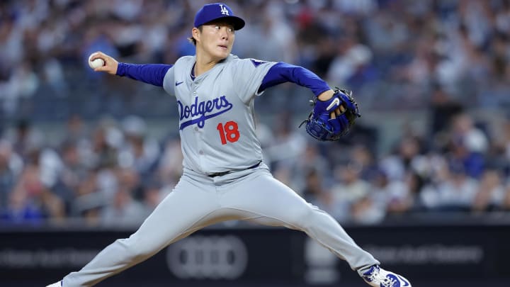 Jun 7, 2024; Bronx, New York, USA; Los Angeles Dodgers starting pitcher Yoshinobu Yamamoto (18) pitches against the New York Yankees during the fifth inning at Yankee Stadium. Mandatory Credit: Brad Penner-USA TODAY Sports