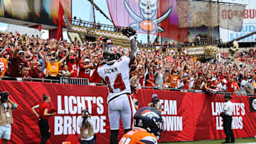 Sep 22, 2024; Tampa, Florida, USA; Tampa Bay Buccaneers wide receiver Chris Godwin (14) celebrates after he scored a touchdown against the Denver Broncos during the first half at Raymond James Stadium. Mandatory Credit: Kim Klement Neitzel-Imagn Images