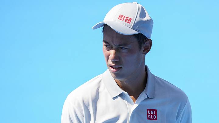 Kei Nishikori stands on the court during the Cincinnati Open