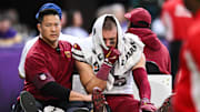 Dec 7, 2025; Minneapolis, Minnesota, USA; Washington Commanders tight end Zach Ertz (86) is carted off the field after an injury during the second half at U.S. Bank Stadium. 