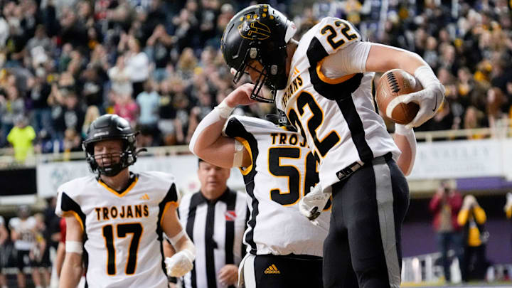 Tri-Center and Carter Kunze won the first-ever state football title for the Trojans Thursday with a 14-10 win over West Hancock. Tri-Center and Carter Kunze won the first-ever state football title for the Trojans Thursday with a 14-10 win over West Hancock.