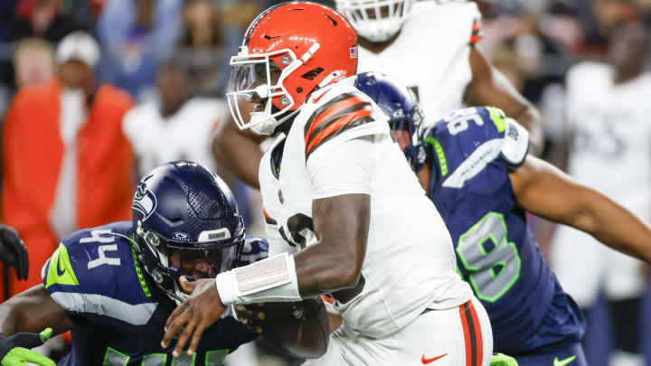 Aug 24, 2024; Seattle, Washington, USA; Seattle Seahawks linebacker Jamie Sheriff (44) sacks Cleveland Browns quarterback Tyler Huntley (10) during the third quarter at Lumen Field.