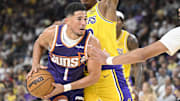 Oct 3, 2025; Palm Desert, California, USA; Los Angeles Lakers forward Rui Hachimura (28) defends against Phoenix Suns guard Devin Booker (1) during the second half at Acrisure Arena. Mandatory Credit: Denis Poroy-Imagn Images