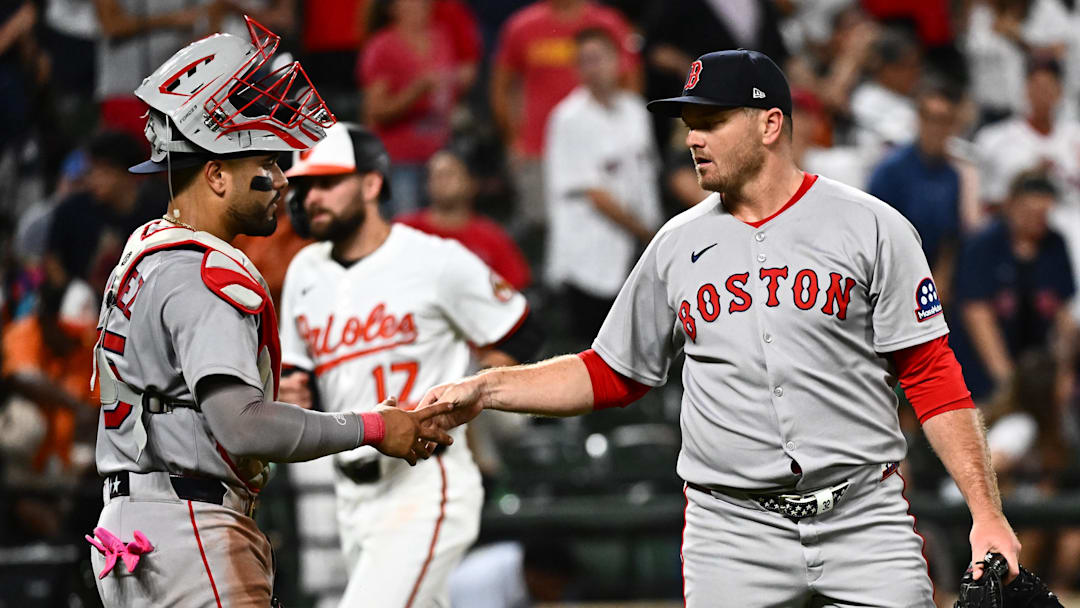 Aug 26, 2025; Baltimore, Maryland, USA; Boston Red Sox pitcher Justin Wilson (right) and catcher Carlos Narvaez (left) celebrate the win against the Baltimore Orioles at Oriole Park at Camden Yards. Mandatory Credit: James A. Pittman-Imagn Images
