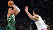 Jan 23, 2025; Milwaukee, Wisconsin, USA;  Milwaukee Bucks forward Giannis Antetokounmpo (34) takes a shot against Miami Heat center Kel'el Ware (7) in the first quarter at Fiserv Forum. Mandatory Credit: Benny Sieu-Imagn Images
