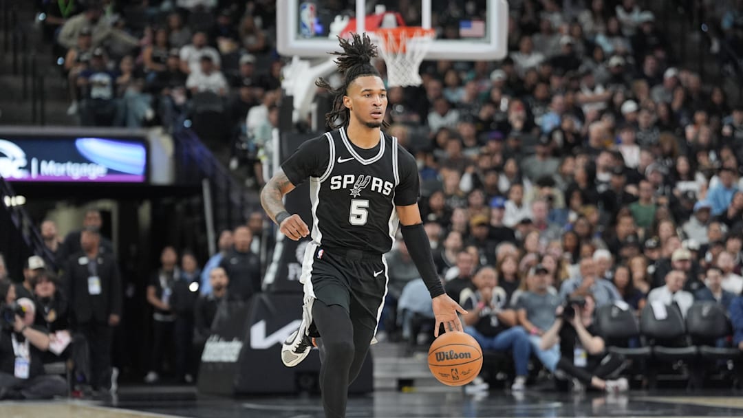 Nov 23, 2024; San Antonio, Texas, USA;  San Antonio Spurs guard Stephon Castle (5) brings the ball up in the first half against the Golden State Warriors at Frost Bank Center. Mandatory Credit: Daniel Dunn-Imagn Images