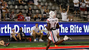 Aug 31, 2024; Tucson, Arizona, USA; Arizona Wildcats running back Jacory Croskey-Merritt (1) scores a touchdown during fourth quarter at Arizona Stadium. Mandatory Credit: Aryanna Frank-Imagn Images