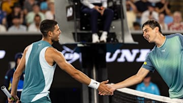 Jan 13, 2025; Melbourne, Victoria, Australia; Carlos Alcaraz of Spain and Alexander Shevchenko of Kazakhstan shake hands during their match in the first round of the men's singles at the 2025 Australian Open at Melbourne Park. Mandatory Credit: Mike Frey-Imagn Images