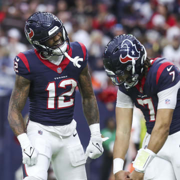 Jan 13, 2024; Houston, Texas, USA; Houston Texans wide receiver Nico Collins (12) celebrates with quarterback C.J. Stroud (7) after a touchdown in a 2024 AFC wild card game against the Cleveland Browns at NRG Stadium. Mandatory Credit: Troy Taormina-USA TODAY Sports