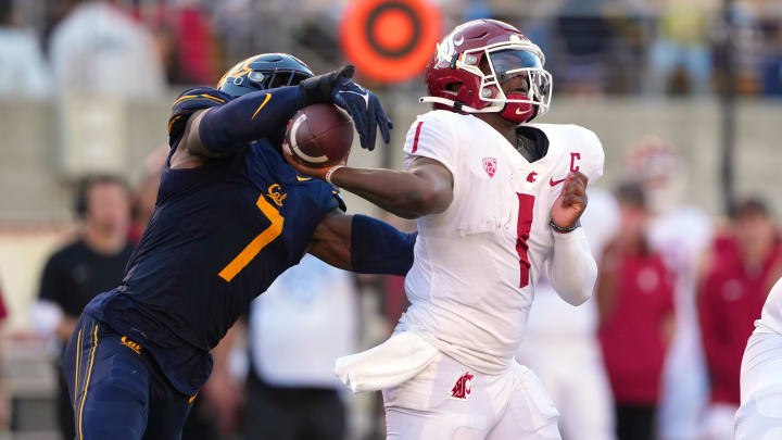 David Reese strips the ball from WSU quarterback Cam Ward.