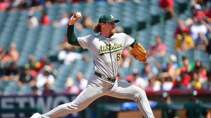 Jun 11, 2025; Anaheim, California, USA; Athletics pitcher Grant Holman (67) throws against the Los Angeles Angels during the sixth inning at Angel Stadium. Mandatory Credit: Gary A. Vasquez-Imagn Images
