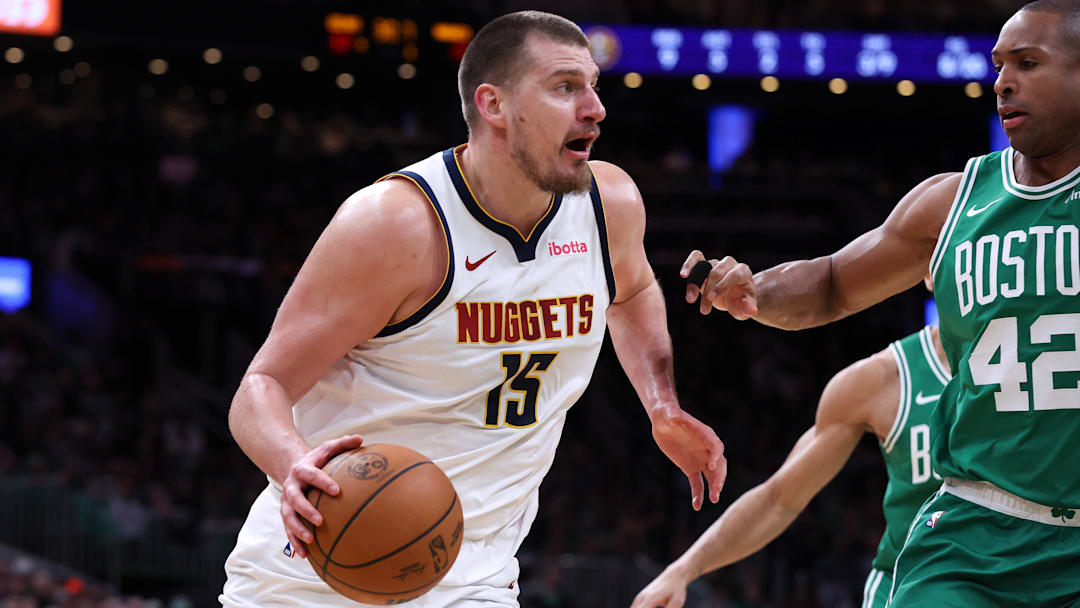 Mar 2, 2025; Boston, Massachusetts, USA: Denver Nuggets center Nikola Jokic (15) drives to the basket defended by Boston Celtics center Al Horford (42) during the first half at TD Garden. Mandatory Credit: Paul Rutherford-Imagn Images