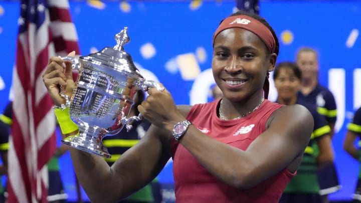 Sep 9, 2023; Flushing, NY, USA; Coco Gauff of the United States celebrates with the championship trophy after her match against Aryna Sabalenka (not pictured) in the women's singles final on day thirteen of the 2023 U.S. Open tennis tournament at USTA Billie Jean King Tennis Center. 