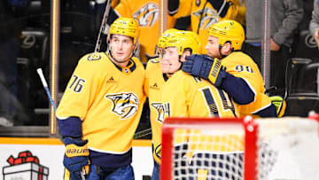Dec 21, 2024; Nashville, Tennessee, USA;  Nashville Predators left wing Zachary L'Heureux (68) celebrates his goal with his teammates  against the Los Angeles Kings during the first period at Bridgestone Arena. Mandatory Credit: Steve Roberts-Imagn Images