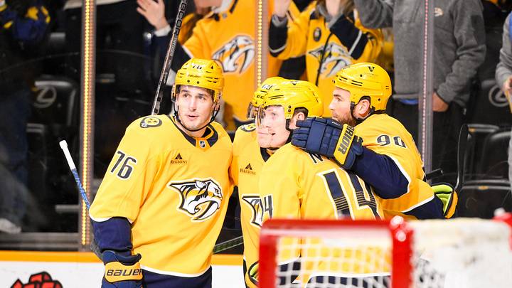 Dec 21, 2024; Nashville, Tennessee, USA;  Nashville Predators left wing Zachary L'Heureux (68) celebrates his goal with his teammates  against the Los Angeles Kings during the first period at Bridgestone Arena. Mandatory Credit: Steve Roberts-Imagn Images