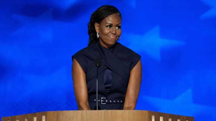 Former first lady Michelle Obama speaks during the second day of the Democratic National Convention at the United Center. Former first lady Michelle Obama speaks during the second day of the Democratic National Convention at the United Center.