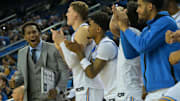 Nov 18, 2025; Los Angeles, California, USA;  UCLA Bruins assistant coach David Singleton reacts along with the bench during the first half against the Sacramento State Hornets at Pauley Pavilion presented by Wescom Financial. Mandatory Credit: Jayne Kamin-Oncea-Imagn Images
